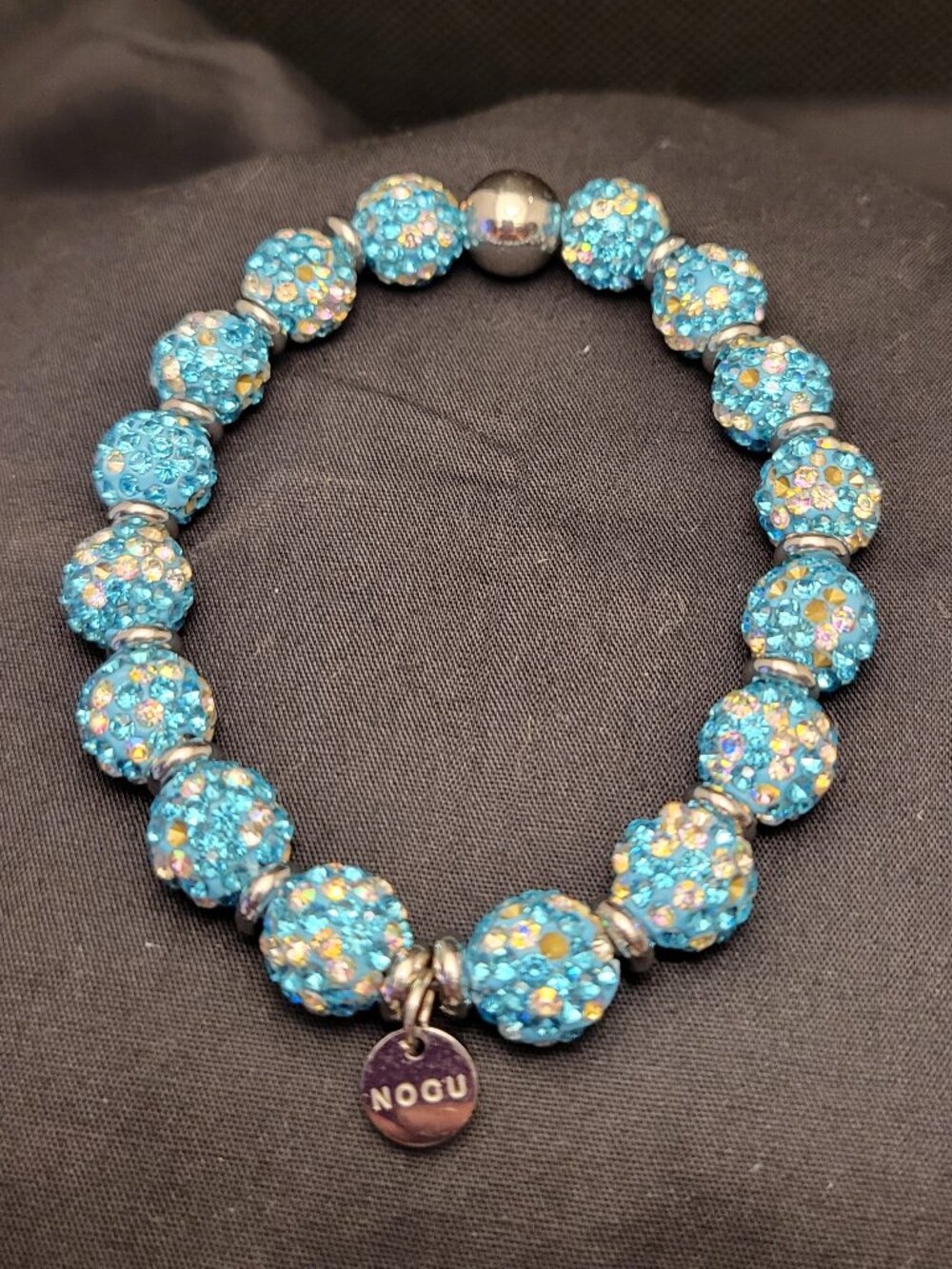 NOGU turquoise confetti crystal stretch bracelet featuring pavé beads